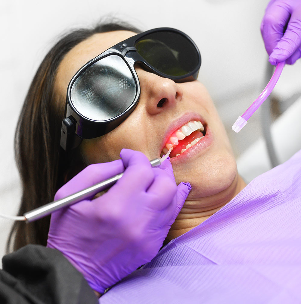 woman receiving dental diode laser therapy